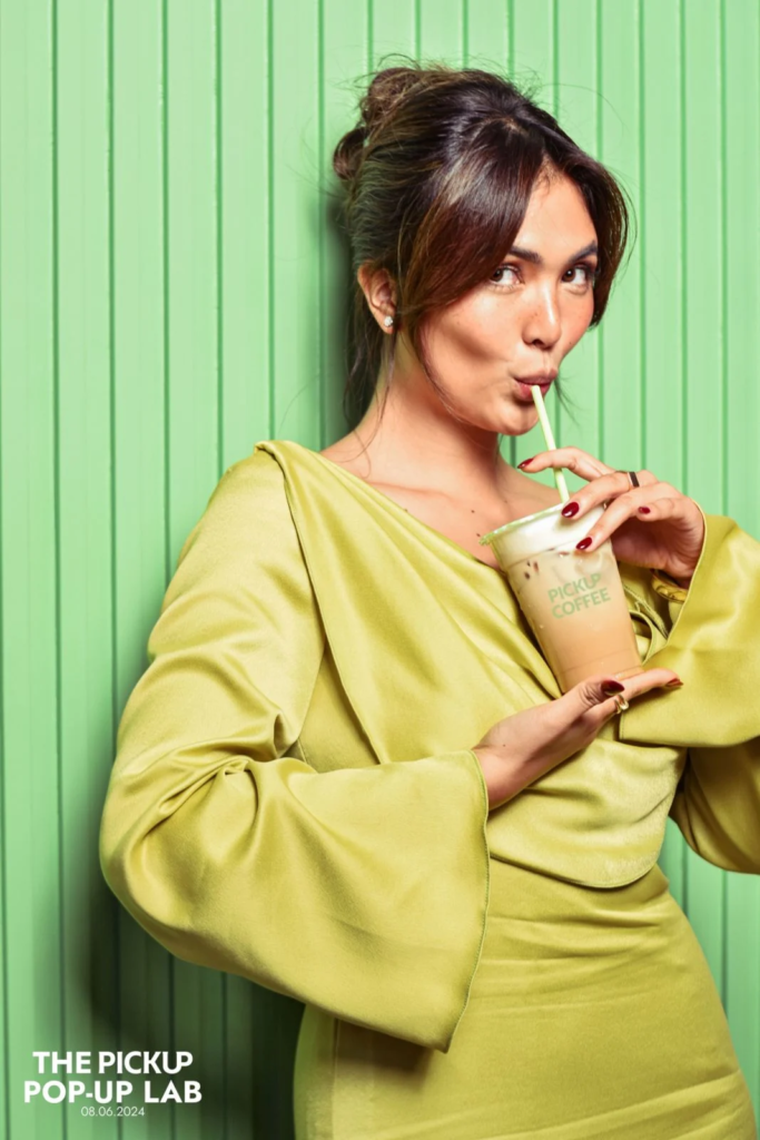 Sofia Andres enjoys her iced PICKUP COFFEE